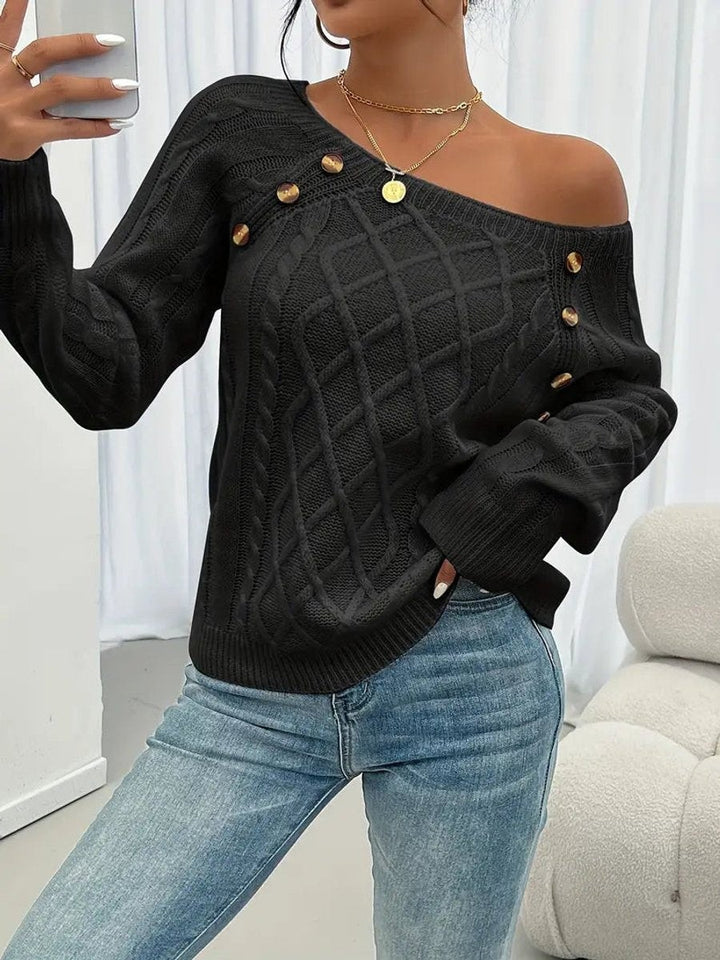 Black cable knit jumper styled with asymmetric off-shoulder neckline and buttons