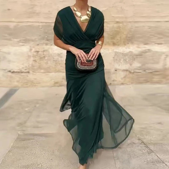 emerald green V-neck midi dress with draped sleeves and flowing chiffon skirt