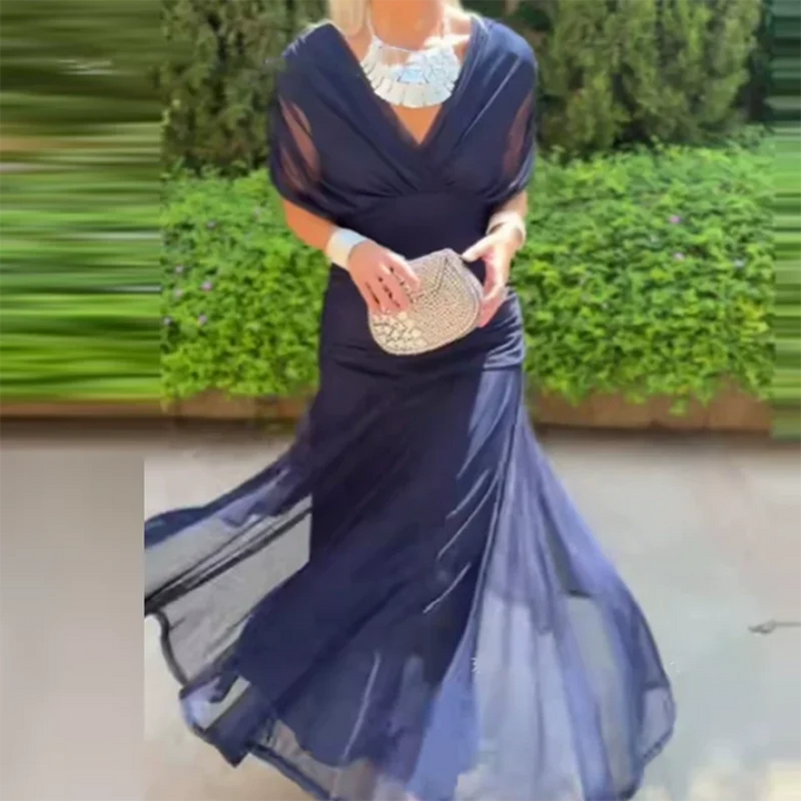 navy blue V-neck midi dress with draped sleeves and sheer chiffon skirt