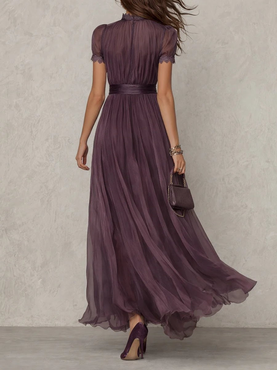 Back view of dusty purple chiffon maxi dress with sheer sleeves and belted waist