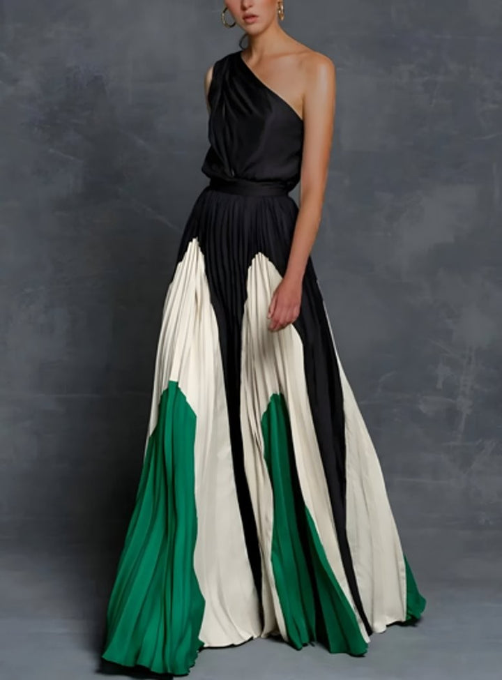 One-shoulder pleated maxi gown featuring black, ivory, and green color-block panels