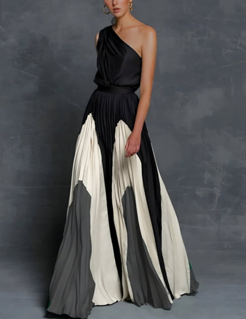 One-shoulder pleated maxi gown with black, ivory, and gray color-block detailing