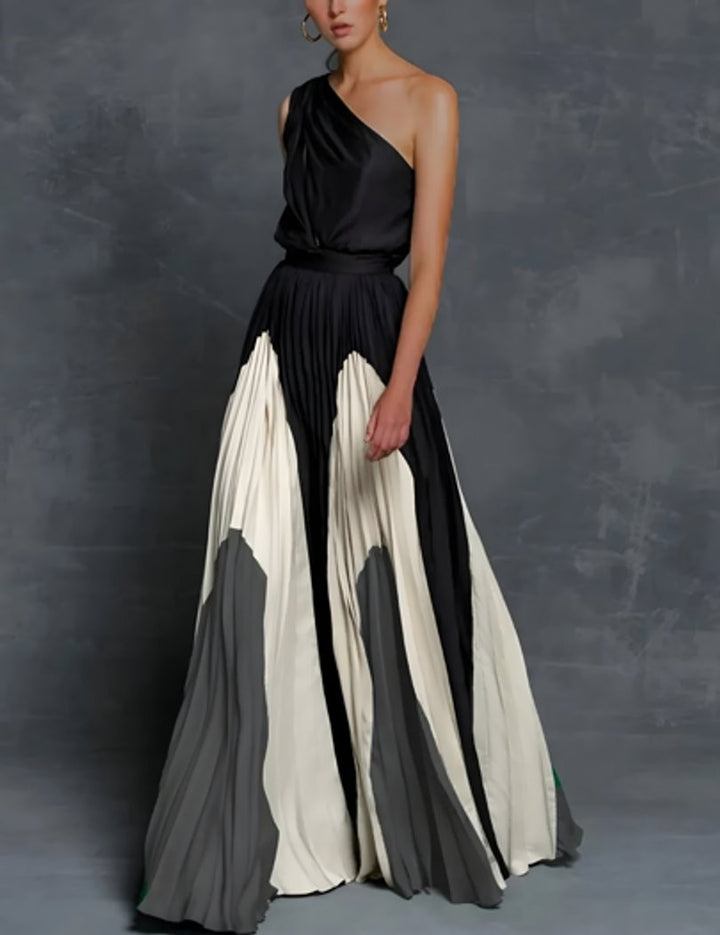 One-shoulder pleated maxi gown with black, ivory, and gray color-block detailing