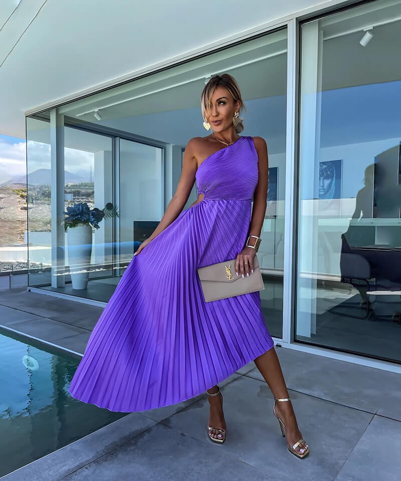 Purple pleated one-shoulder midi dress with cutout waist styled poolside for evening event
