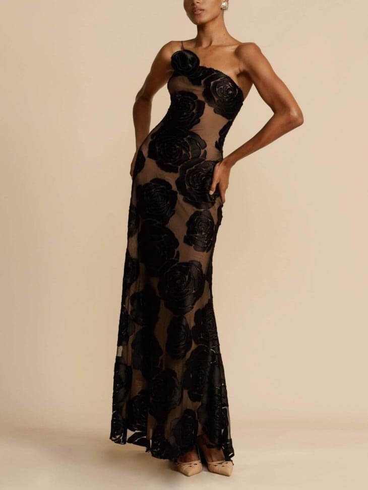 Black floral applique gown with sheer nude lining and one-shoulder neckline