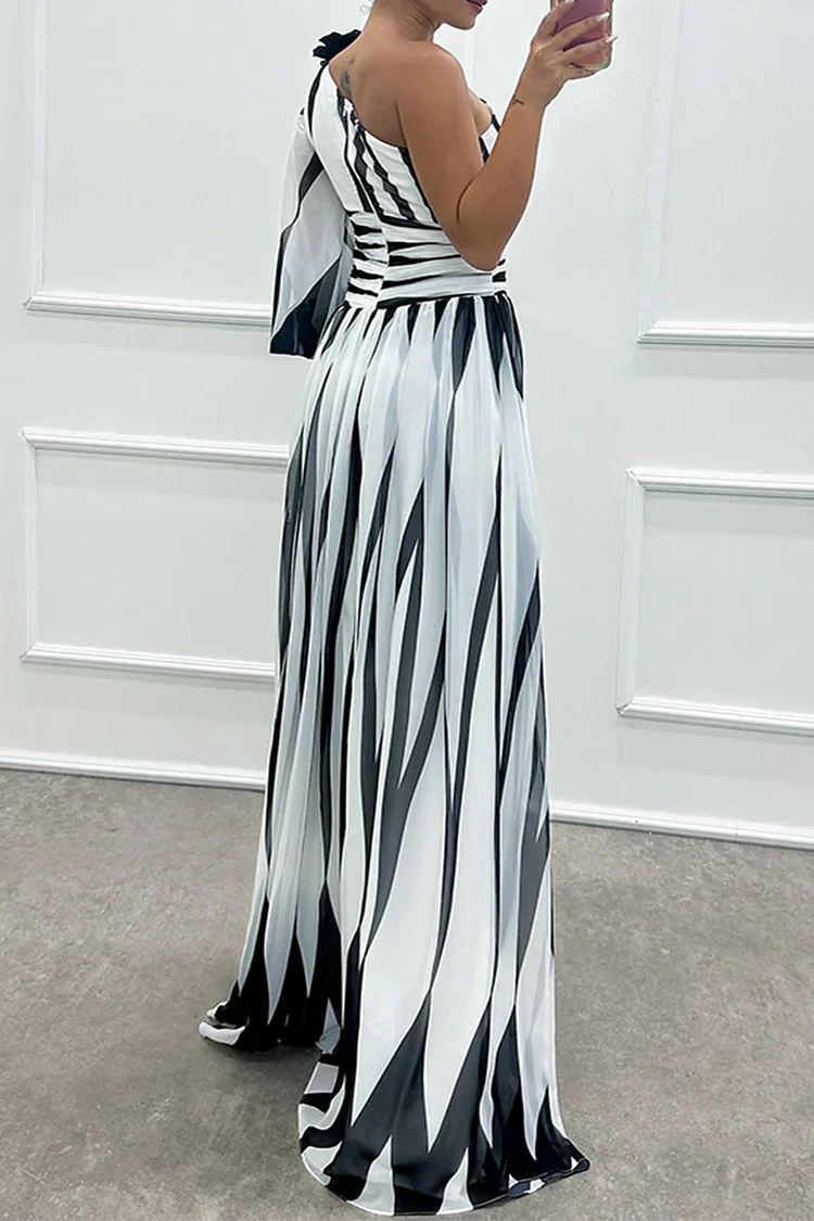 Back view of black and white striped one-shoulder maxi gown