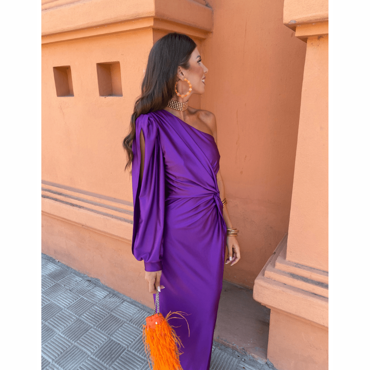 Purple satin wedding guest dress with gathered shoulder and twist waist