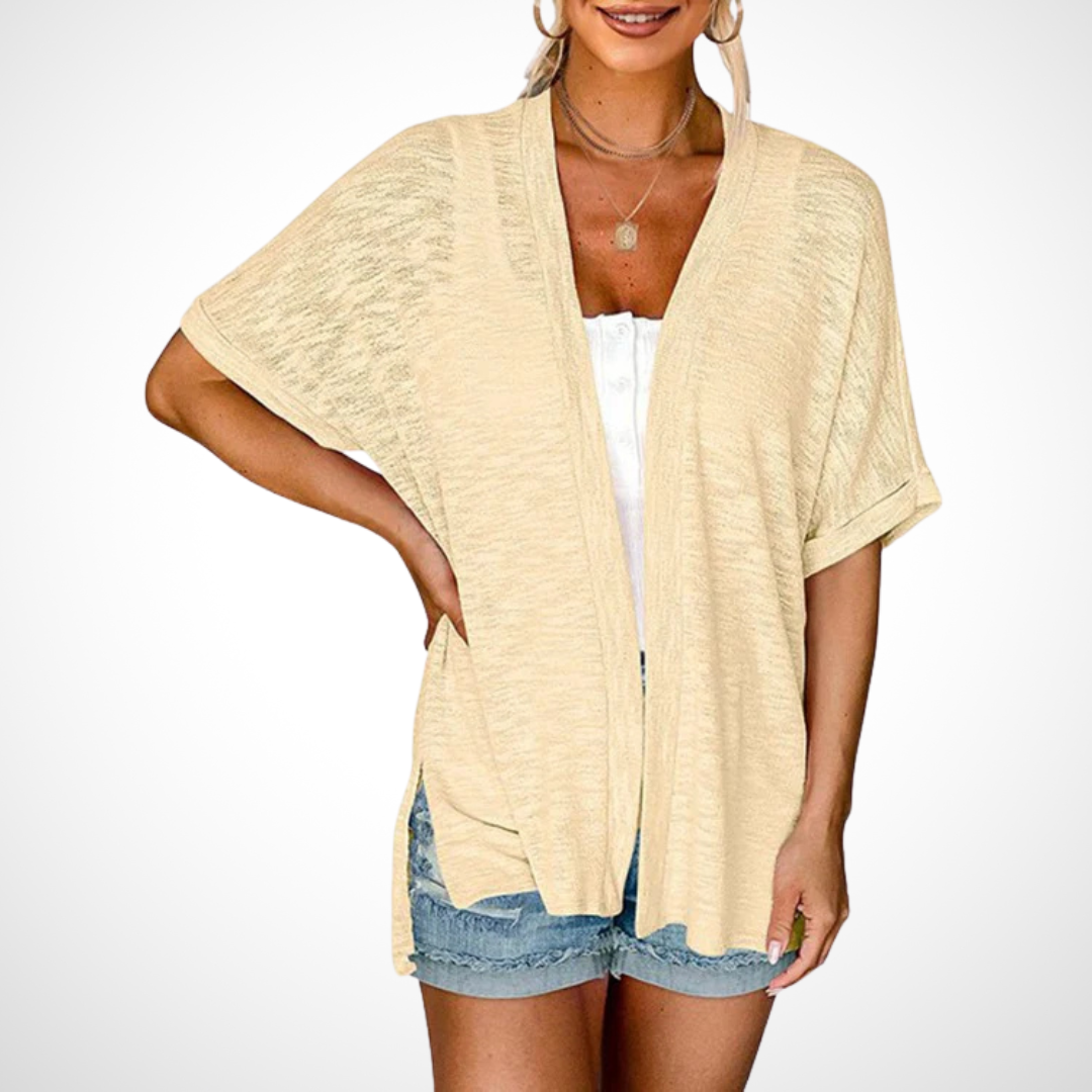 beige open-front kimono cardigan with short sleeves over white tank top