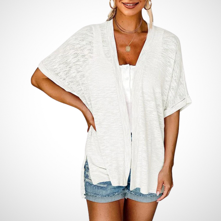 white lightweight open-front cardigan styled with denim shorts and tank top