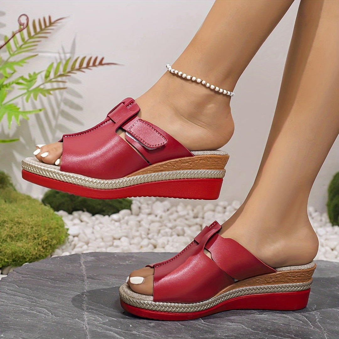 Red wedge sandals featuring espadrille platform and cutout strap design