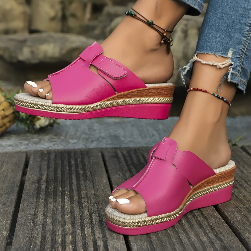 Fuchsia wedge sandals featuring woven jute midsole and adjustable ankle strap