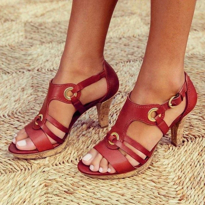 red leather caged sandal with cork stiletto heel and buckle strap