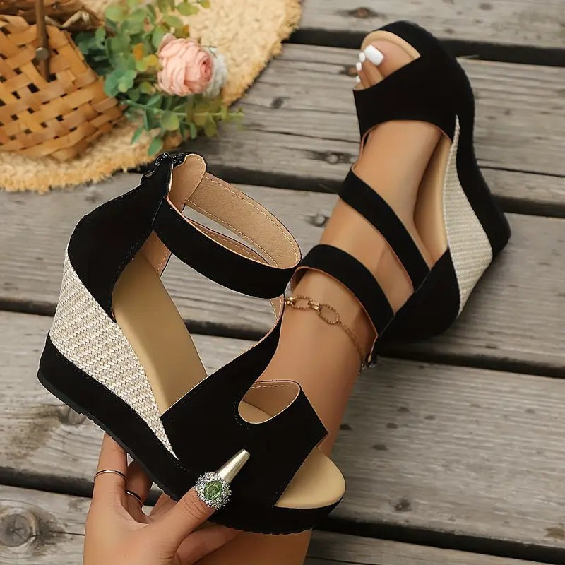 Black wedge sandals with woven straw wedge heel and ankle strap detail