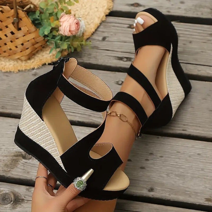 Black wedge sandals with woven straw wedge heel and ankle strap detail