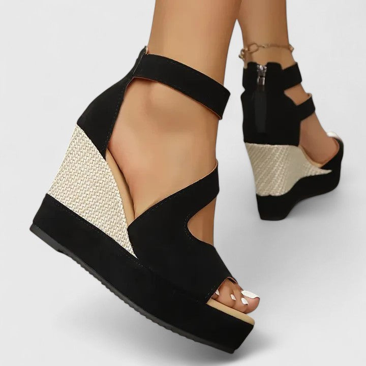 black wedge sandals with woven heel viewed from behind