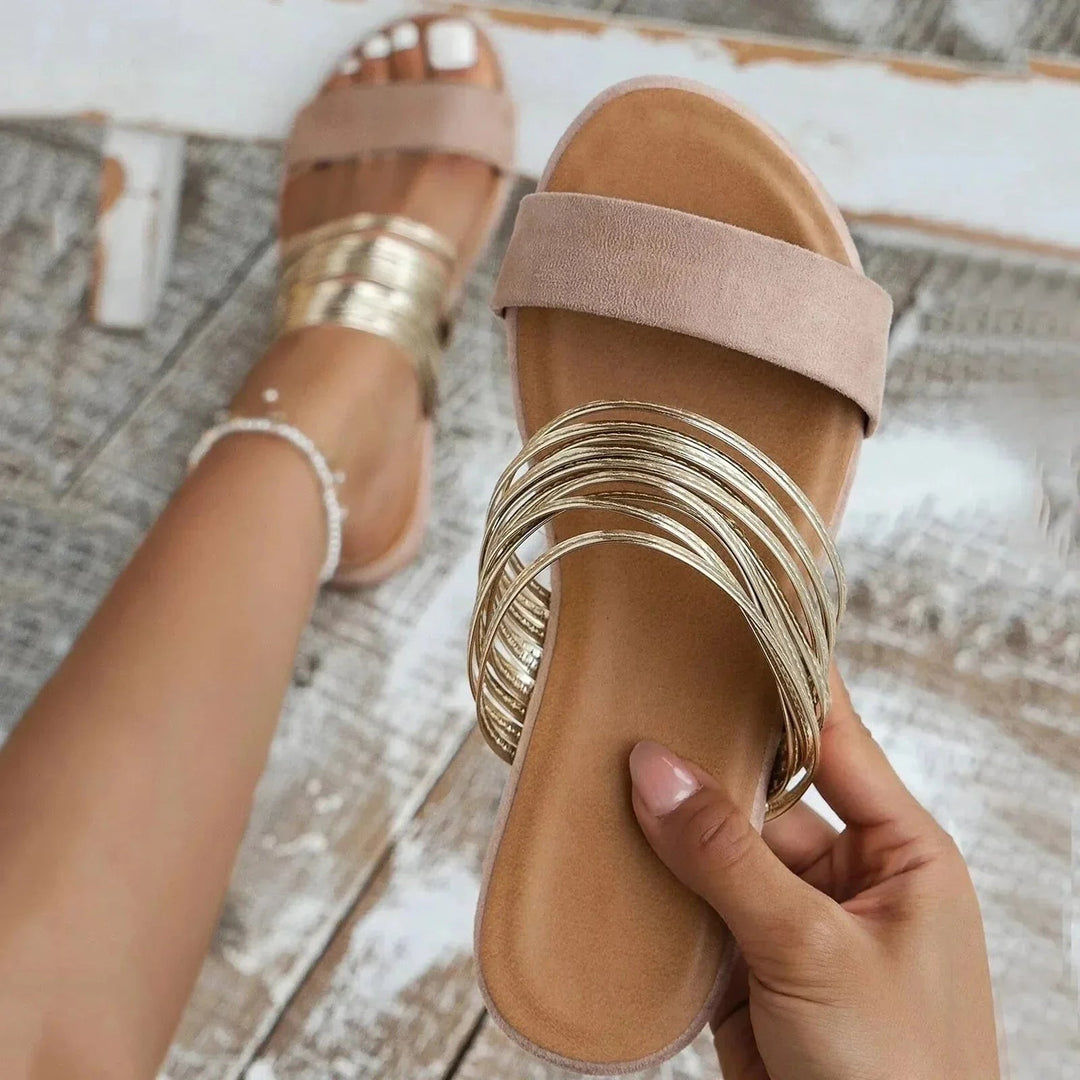 Blush pink slide sandal with multi-strand gold toe strap