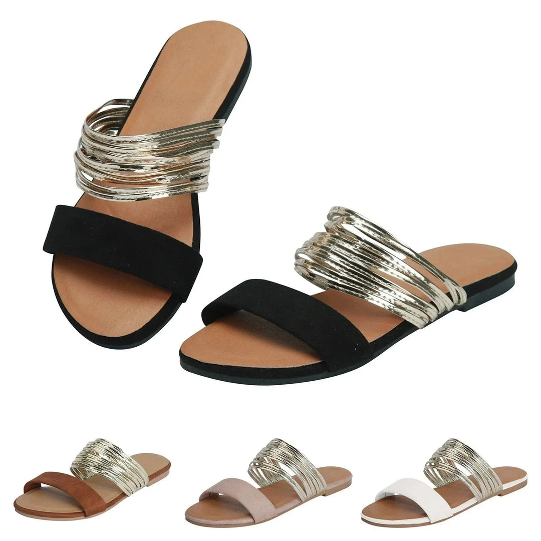 Black double-strap flat sandal with metallic gold strap detail
