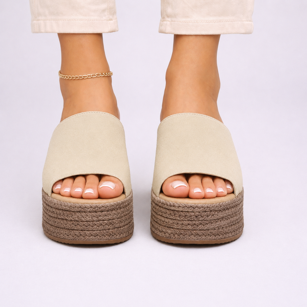 Front view of beige espadrille wedge sandals with woven jute platform heel