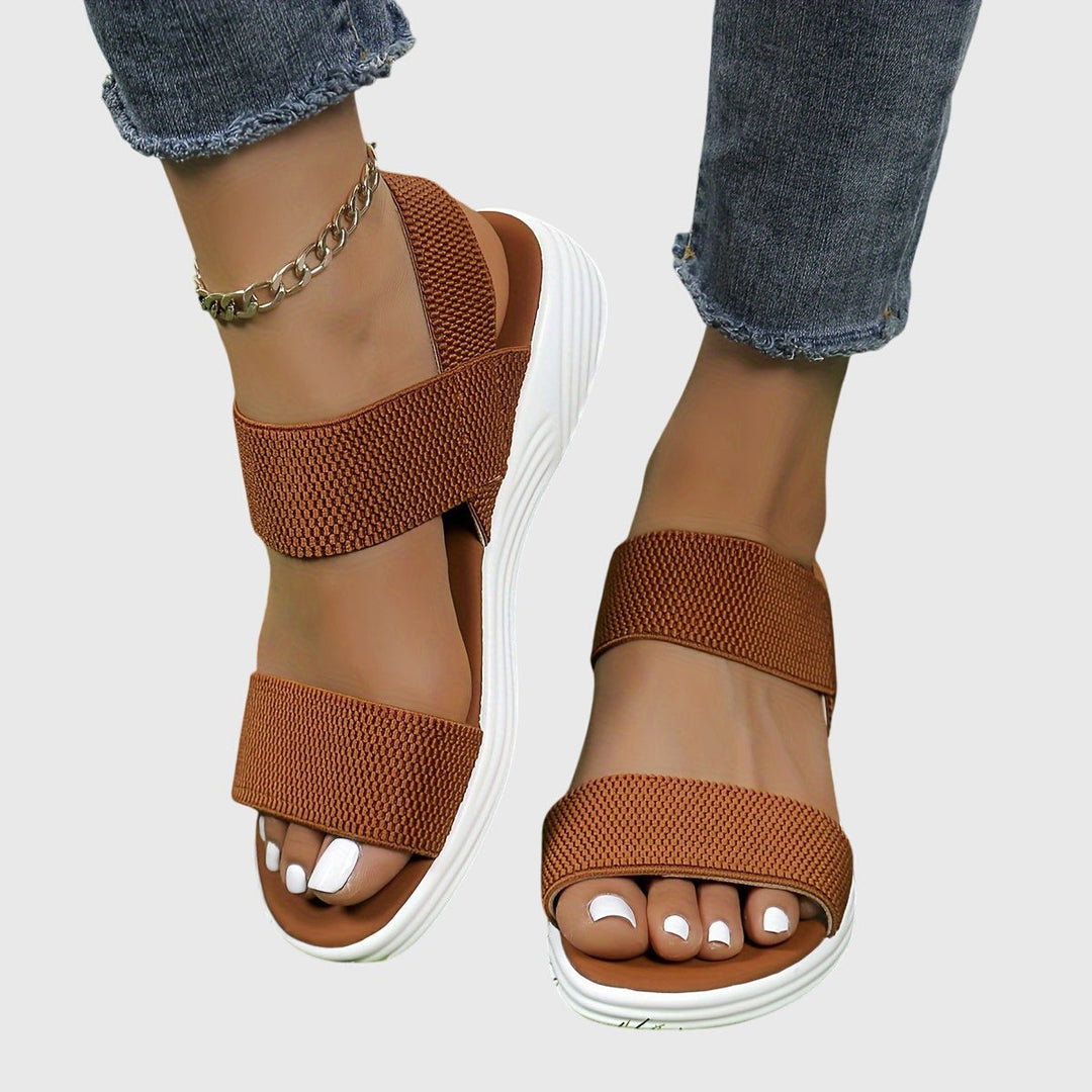 Cognac brown woven strap sandals with white platform sole, ankle wrap style