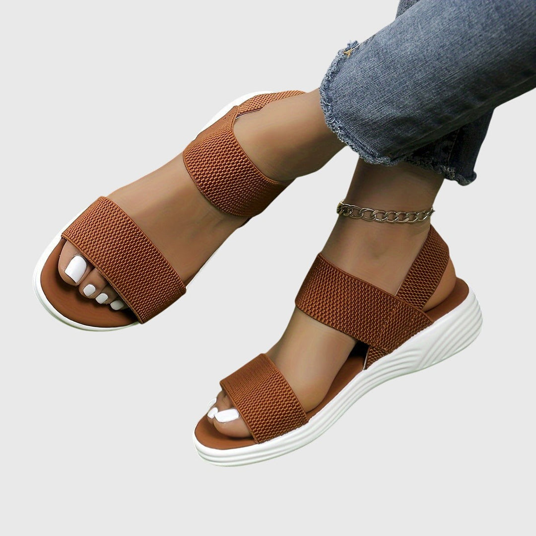 Cognac brown crisscross ankle strap sandals with white wedge platform sole
