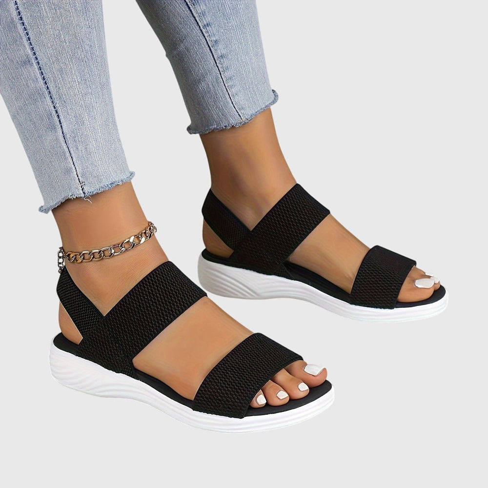 Black elastic double-strap sandals with slingback and white platform sole