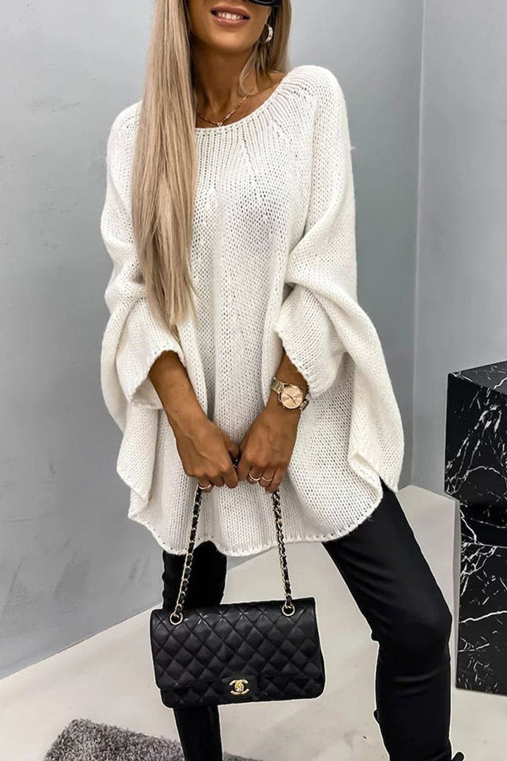 white oversized crewneck sweater with batwing sleeves and dropped hem for a relaxed fit