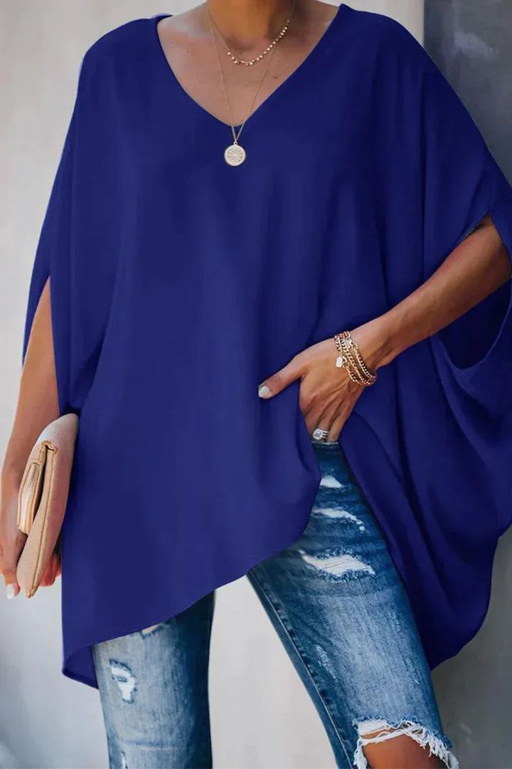 Navy blue oversized tunic top with V-neck and relaxed batwing sleeves