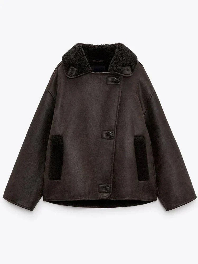 Flat lay of brown leather jacket with shearling collar and buttoned front