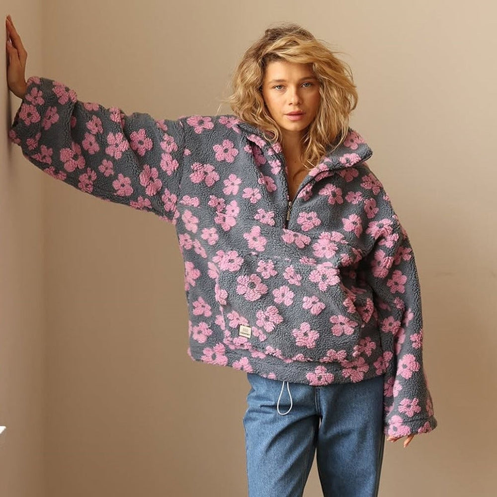 Oversized pink floral sherpa fleece pullover styled with straight-leg jeans