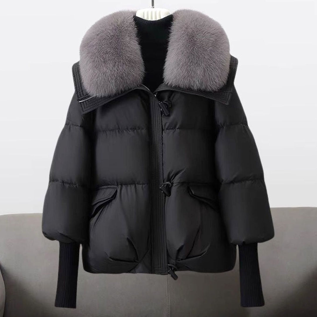 Black puffer jacket with plush gray fox fur collar and ribbed cuffs