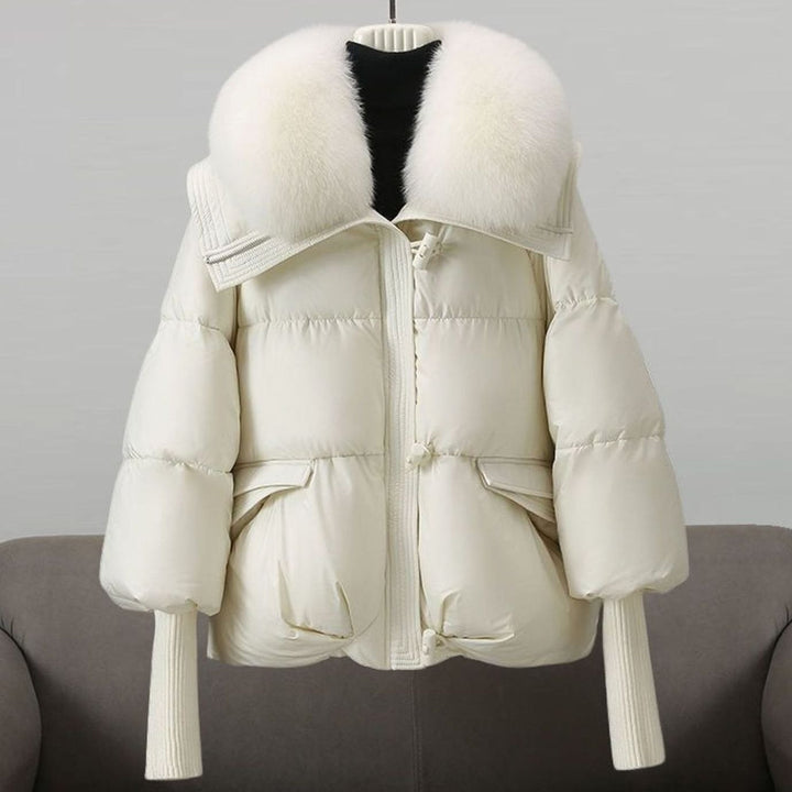 Ivory puffer jacket featuring oversized white fur collar and knit cuffs