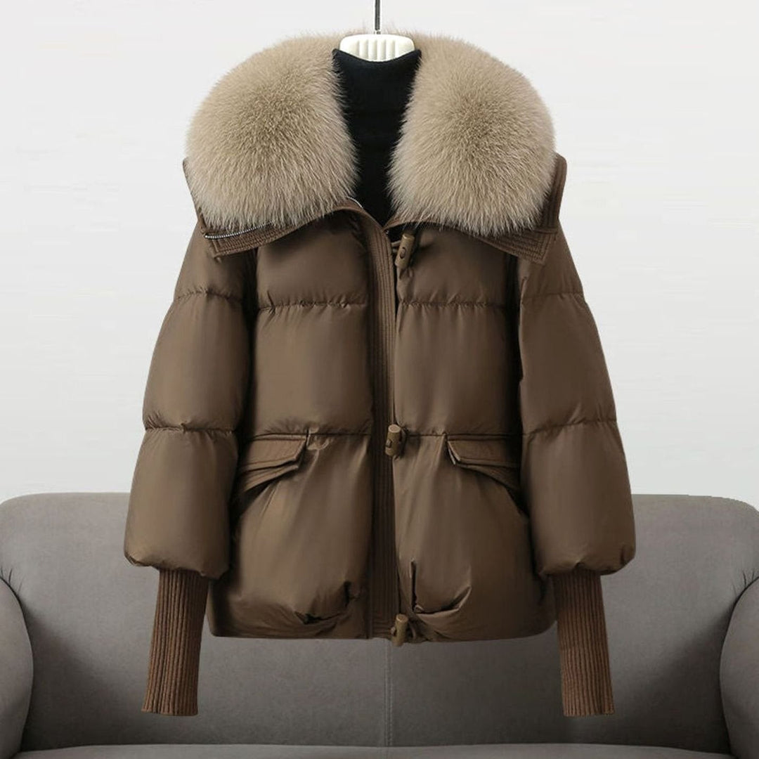 Brown puffer jacket with tan fur collar and ribbed sleeve cuffs