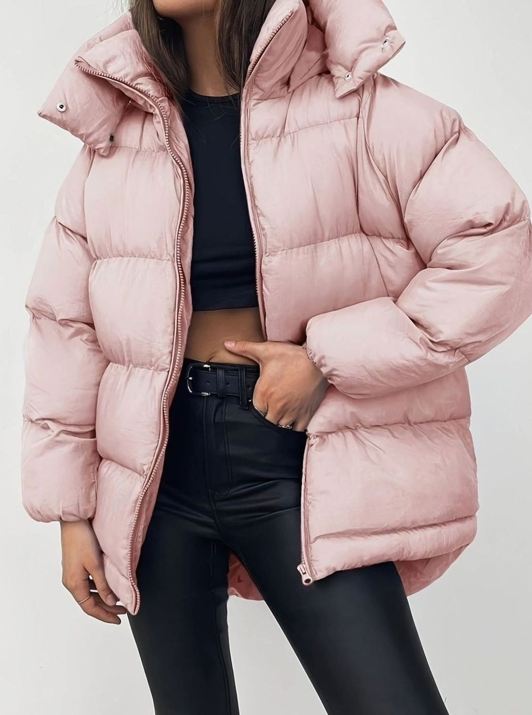 Blush pink stand-collar puffer jacket worn with black leather-look trousers