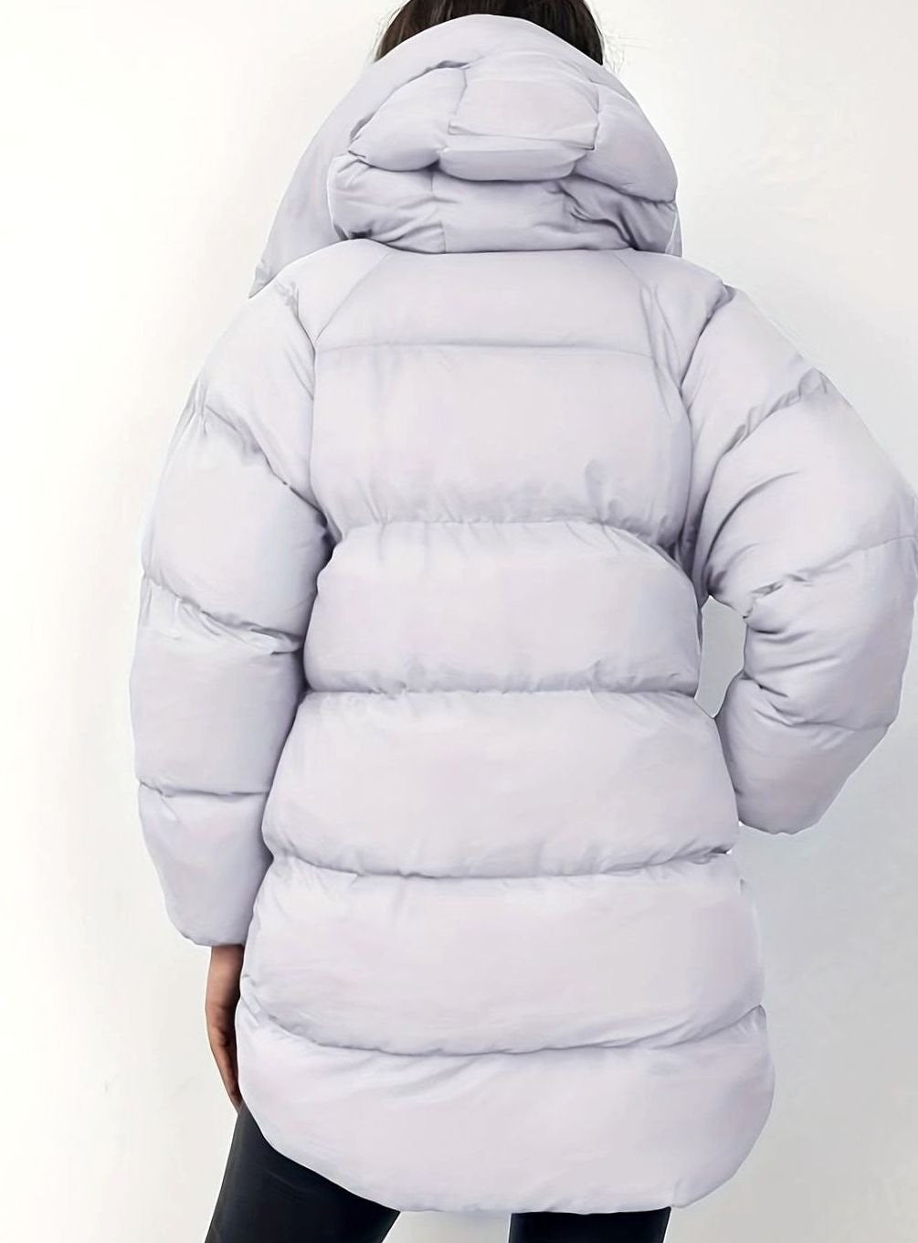 Pale grey oversized puffer jacket with hood, rear view showing quilted panels