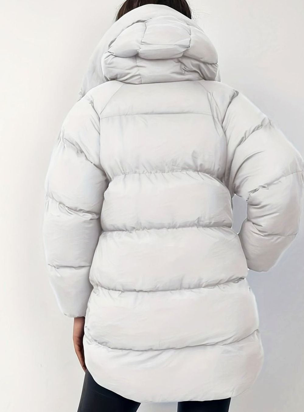 Light grey hooded puffer coat shown from behind against plain backdrop