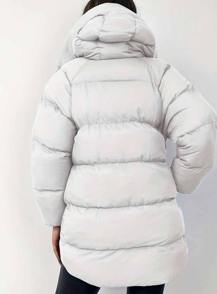 Light grey hooded puffer coat shown from behind against plain backdrop