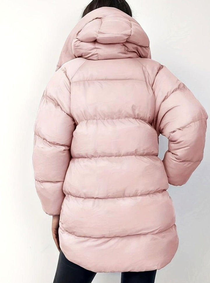 Blush pink quilted puffer jacket with hood, rear view highlighting panelling