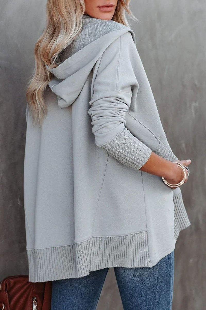 back view of gray hooded tunic sweatshirt with drop-shoulder silhouette