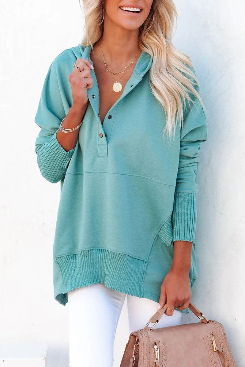 teal oversized hooded sweatshirt with snap-button placket and ribbed cuffs