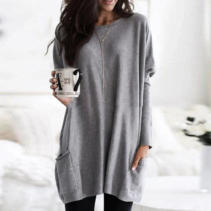 Light gray long-sleeve pocket tunic top in an oversized relaxed style