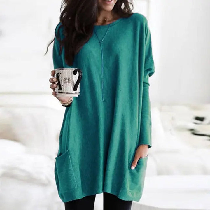 Teal oversized tunic top with long sleeves and front pocket detail
