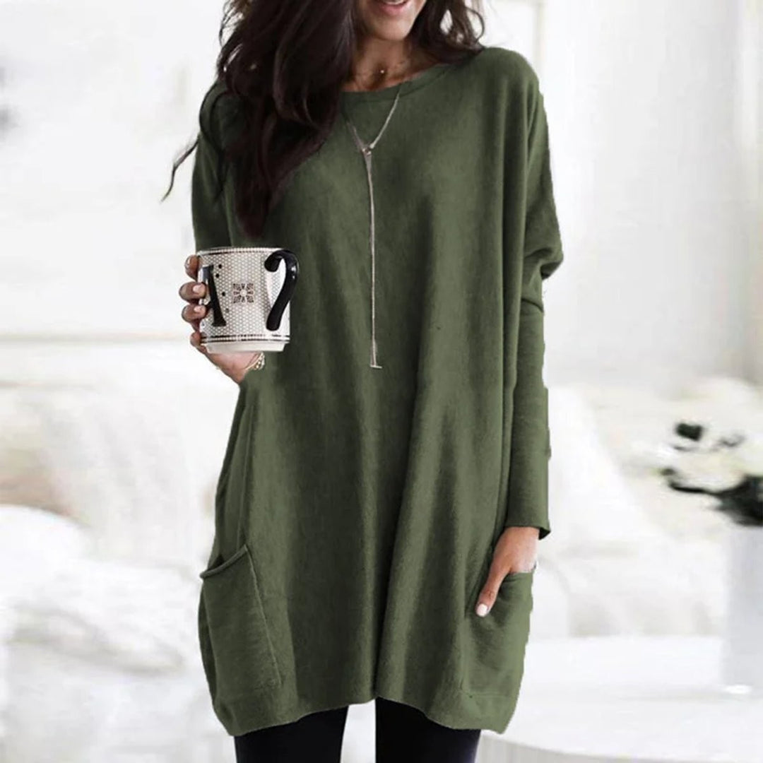 Olive green oversized tunic top with front pocket and relaxed batwing sleeves