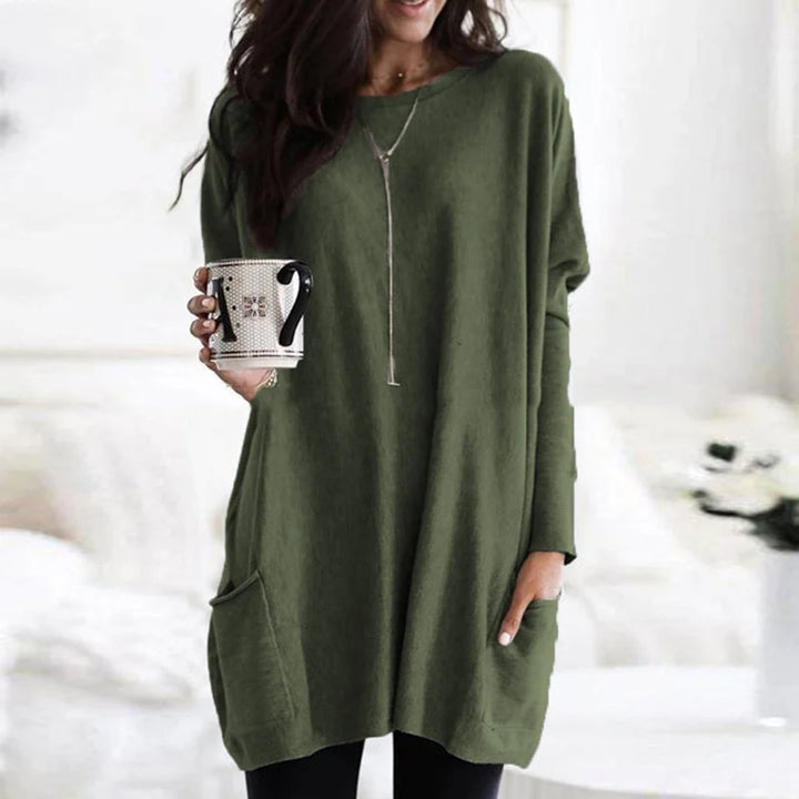 Olive green oversized tunic top with front pocket and relaxed batwing sleeves