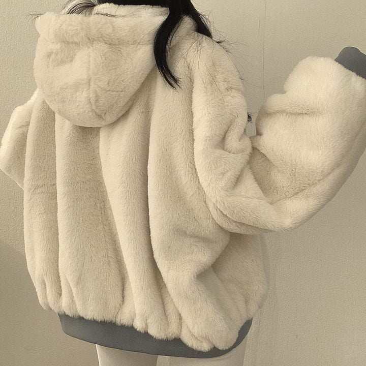Cream fluffy hooded jacket showing plush texture from behind