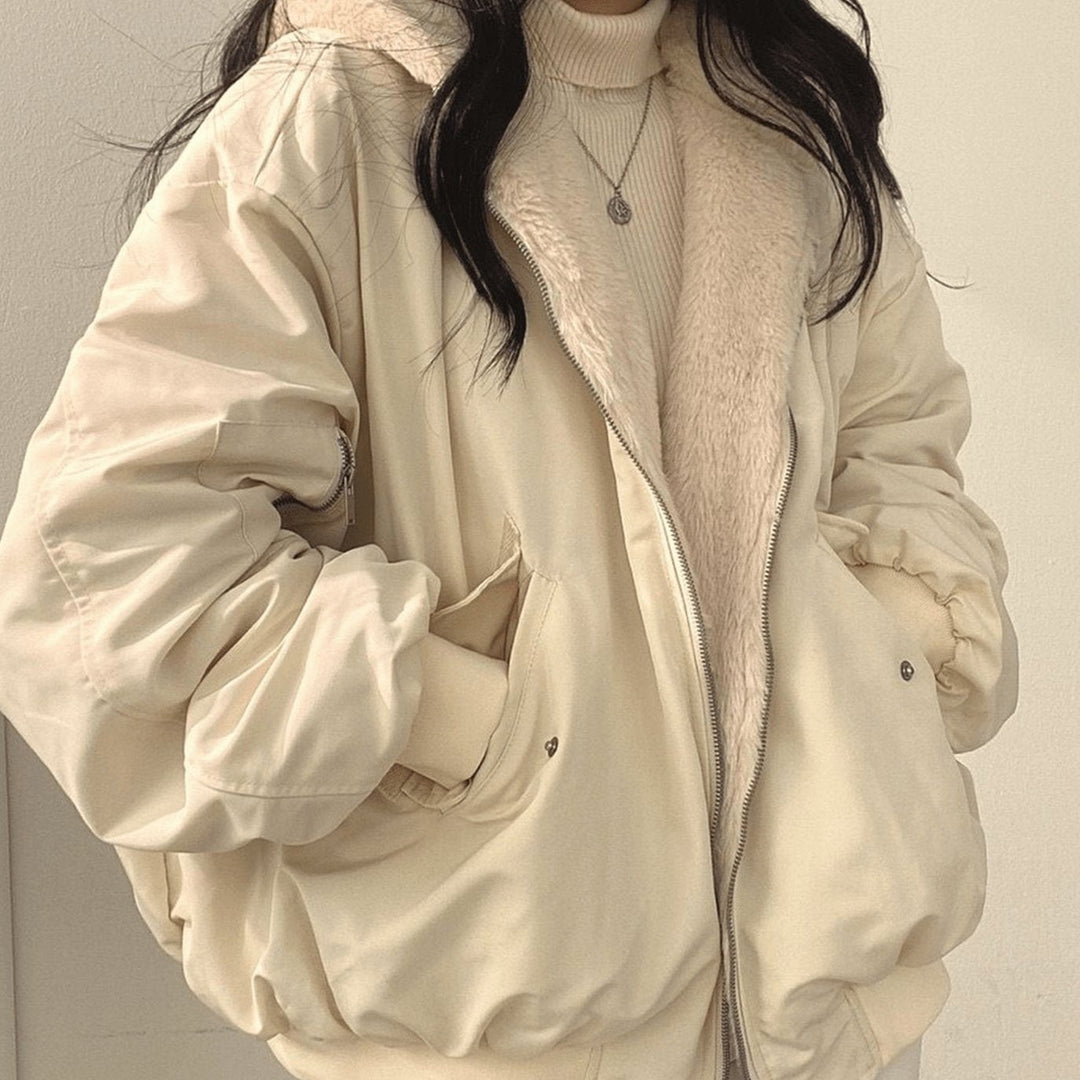Cream reversible bomber jacket with fluffy hood, worn open