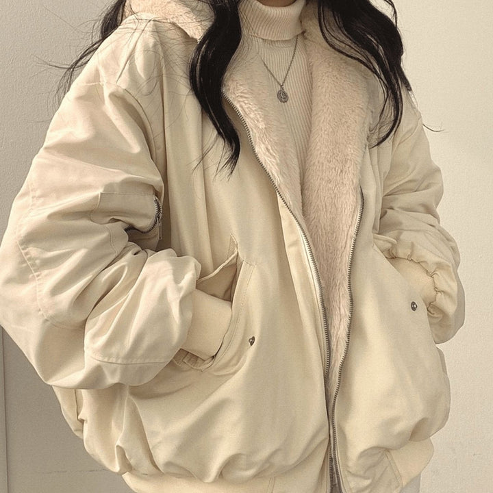 Cream reversible bomber jacket with fluffy hood, worn open
