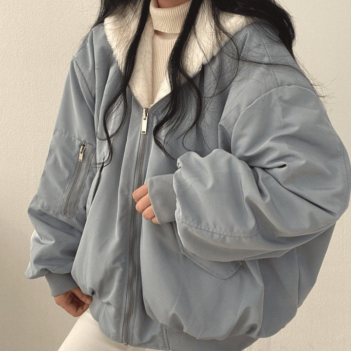 Reversible fleece-lined bomber jacket in dusty blue with zip pockets