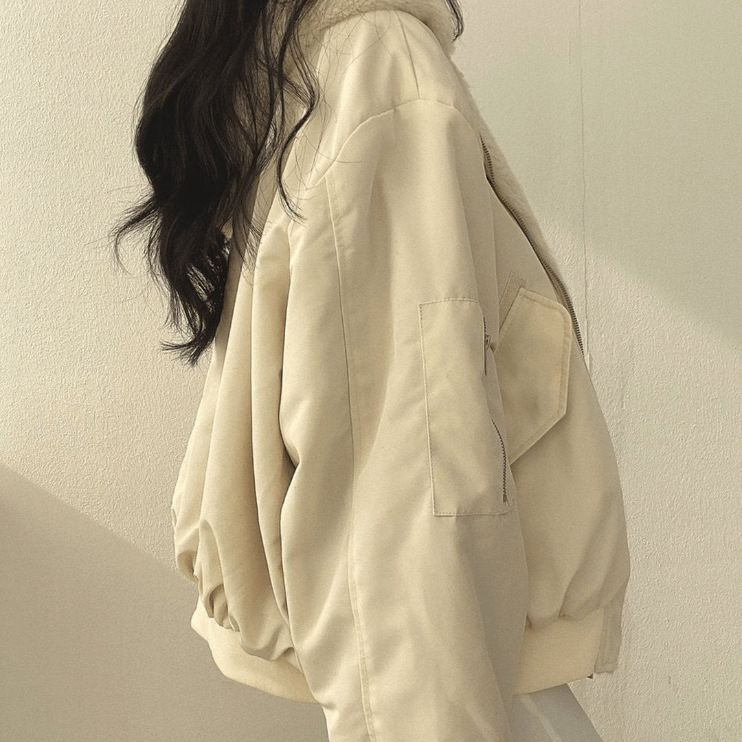 Cream oversized bomber jacket showing zip sleeve pocket detail