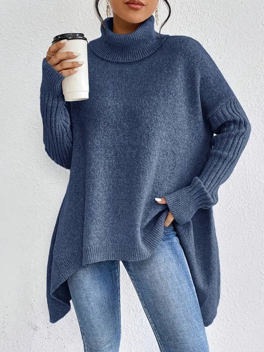 Blue oversized turtleneck sweater with ribbed sleeves and asymmetrical high-low hem