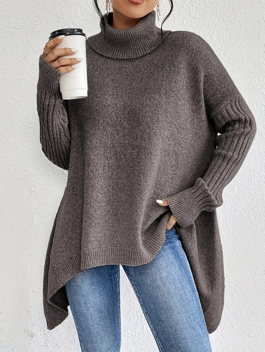Brown oversized turtleneck sweater with ribbed cuffs and flowy uneven hem